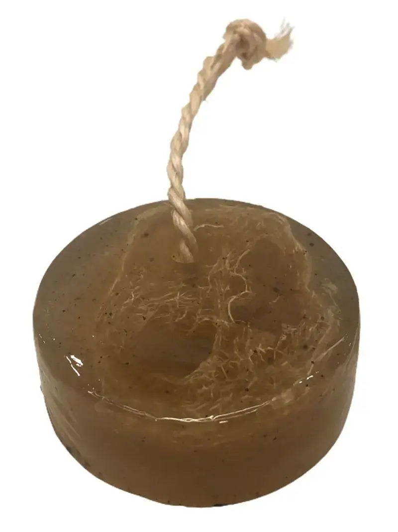 Pristine Soap Bar with loofah on a rope, enriched with green clay, bamboo, and green tea for natural cleansing and moisturizing.