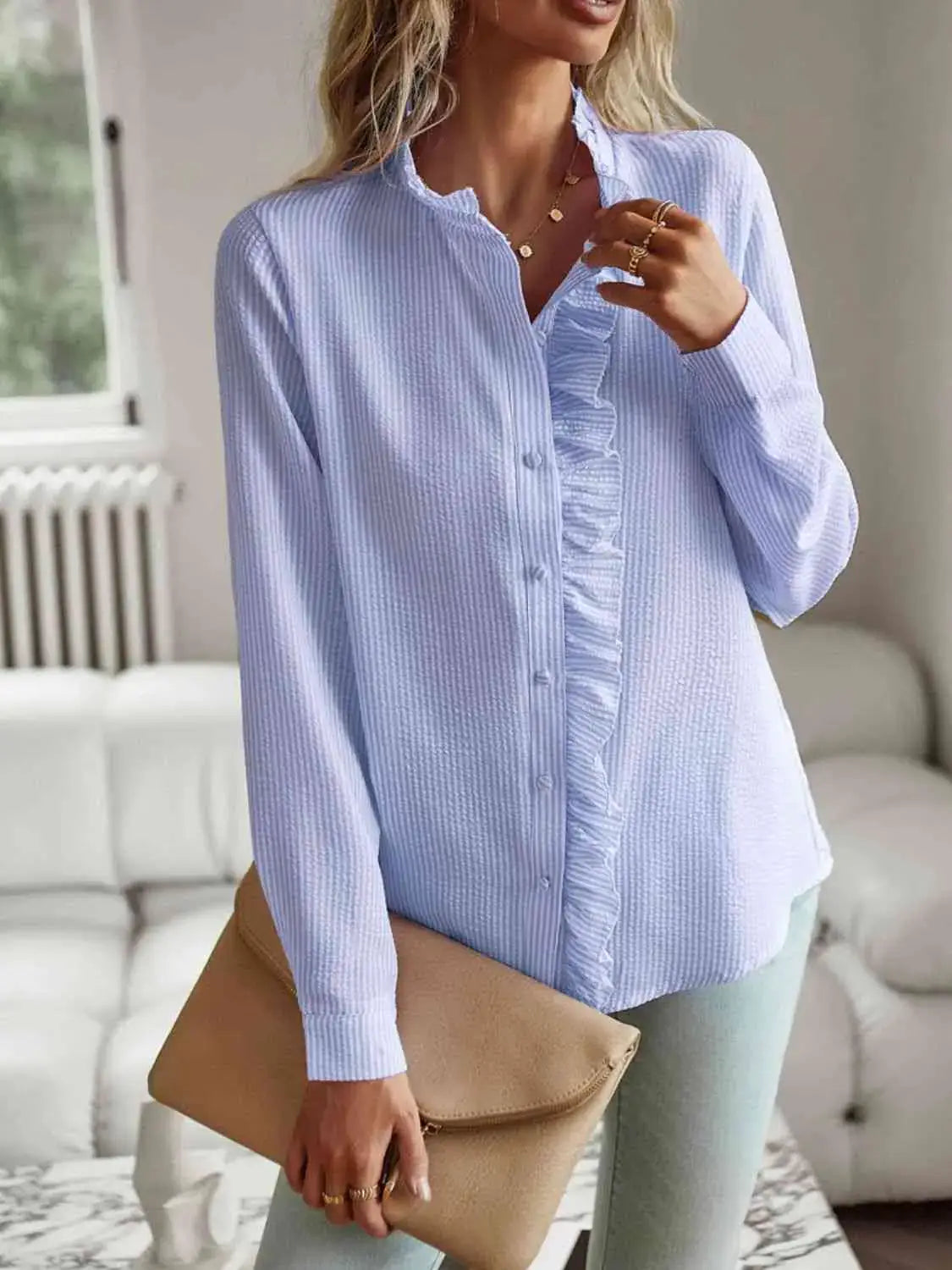 Feminine Nat Ruffle Trim Long Sleeve Shirt in light blue, featuring delicate ruffle detail and stylish button front.
