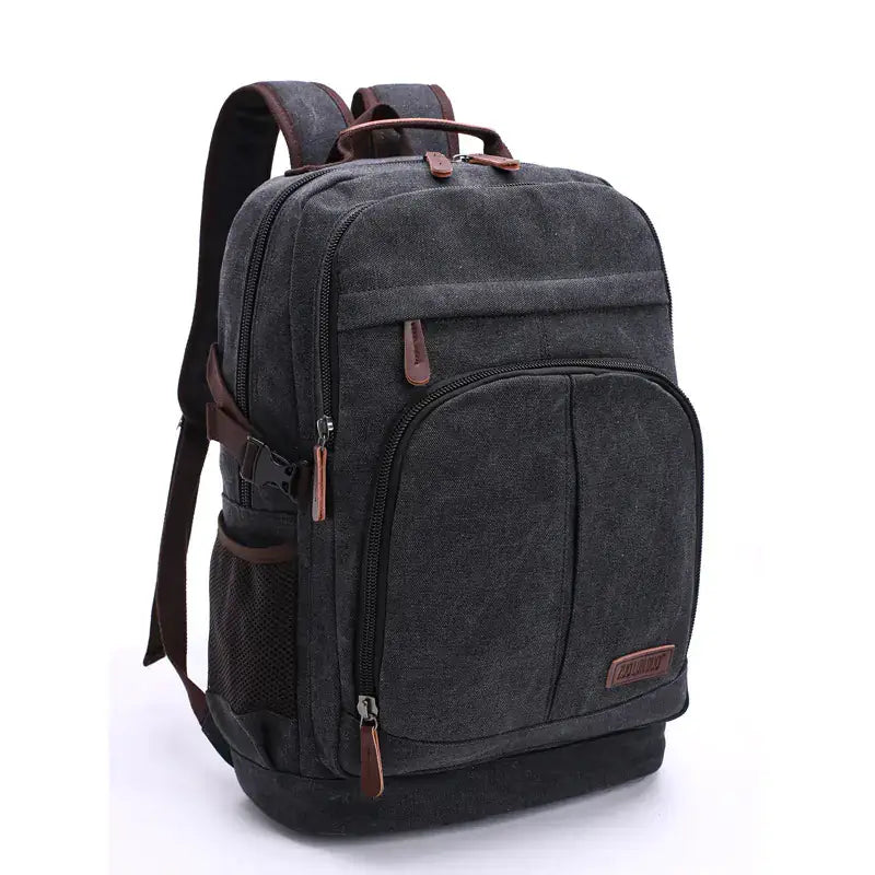 Large capacity canvas backpack for men and women in black with brown accents, ideal for everyday use and outdoor activities.