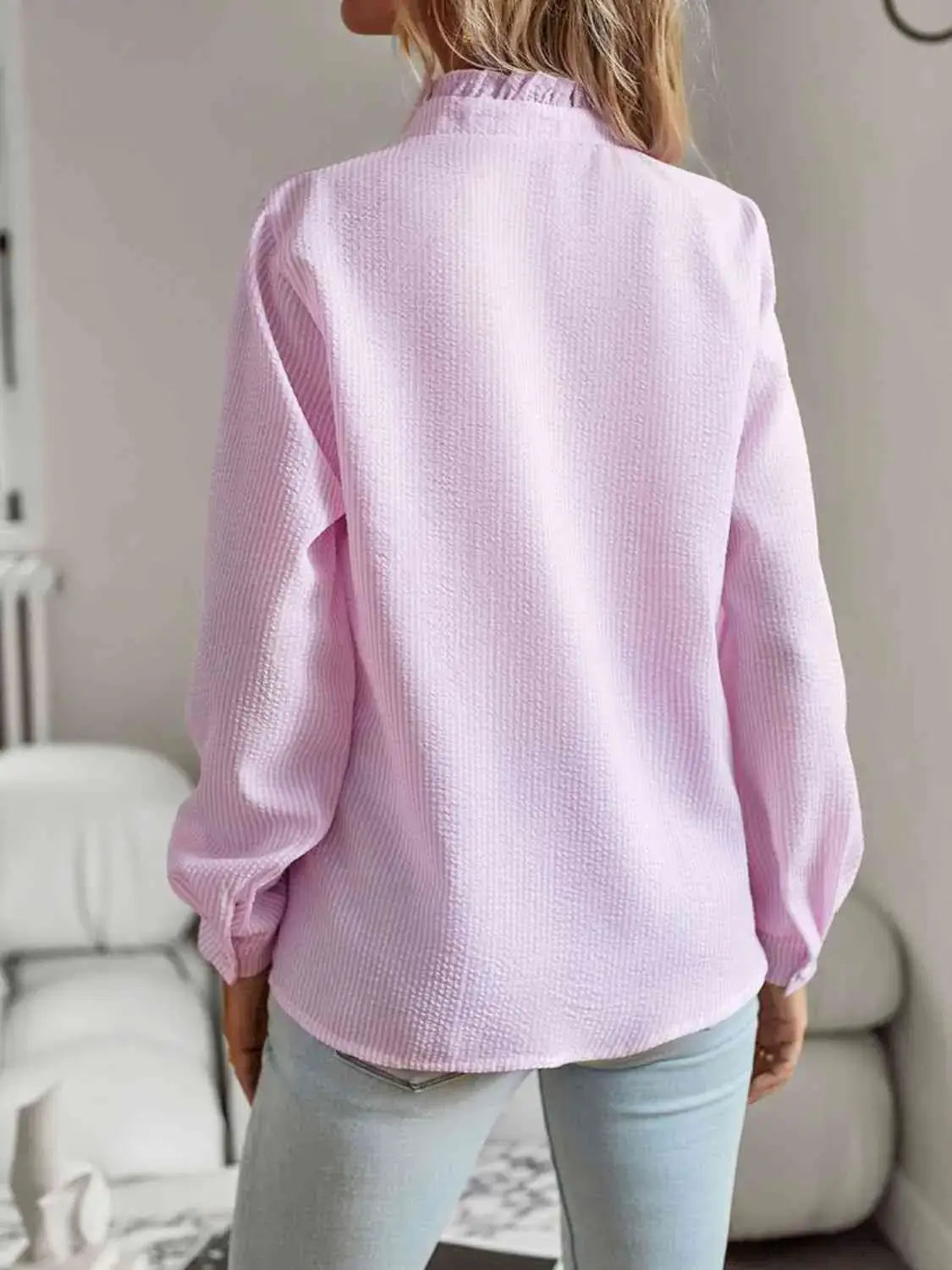 Back view of the Nat Ruffle Trim Long Sleeve Shirt in soft pink, showcasing delicate ruffle details and a relaxed fit.